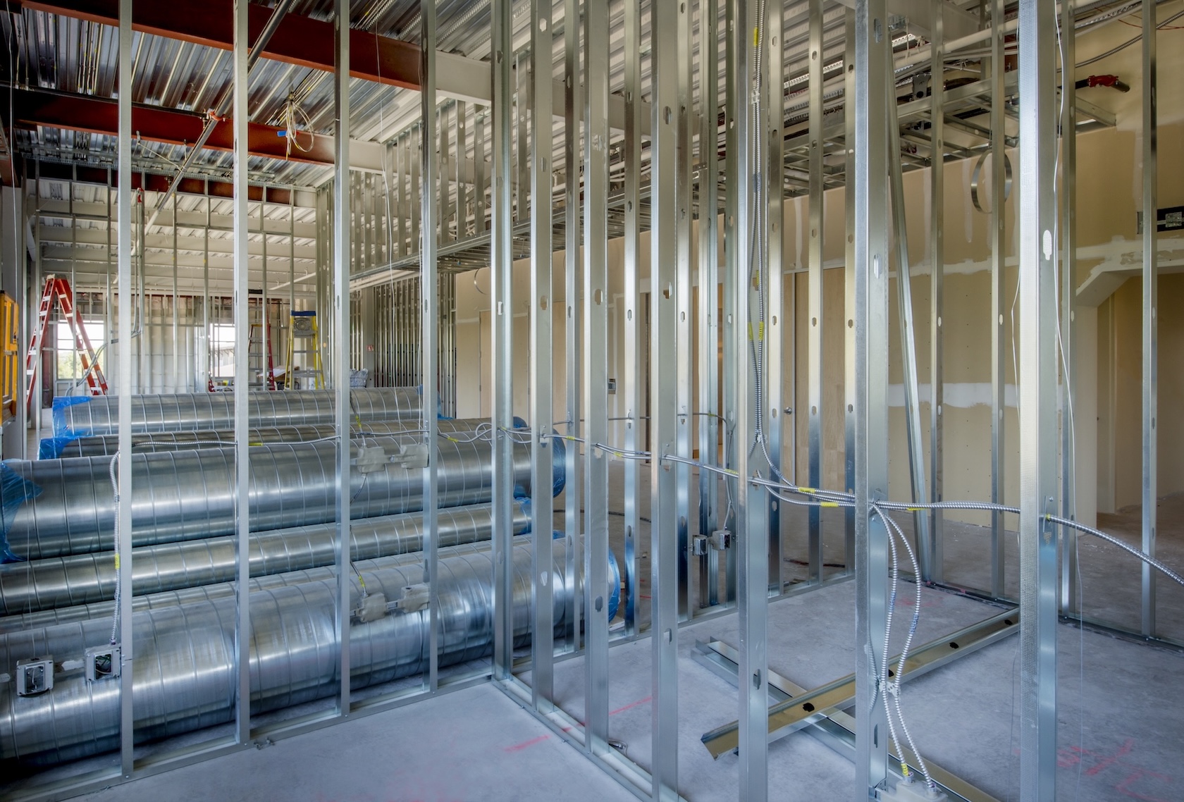 Interior office construction with steel stud walls.